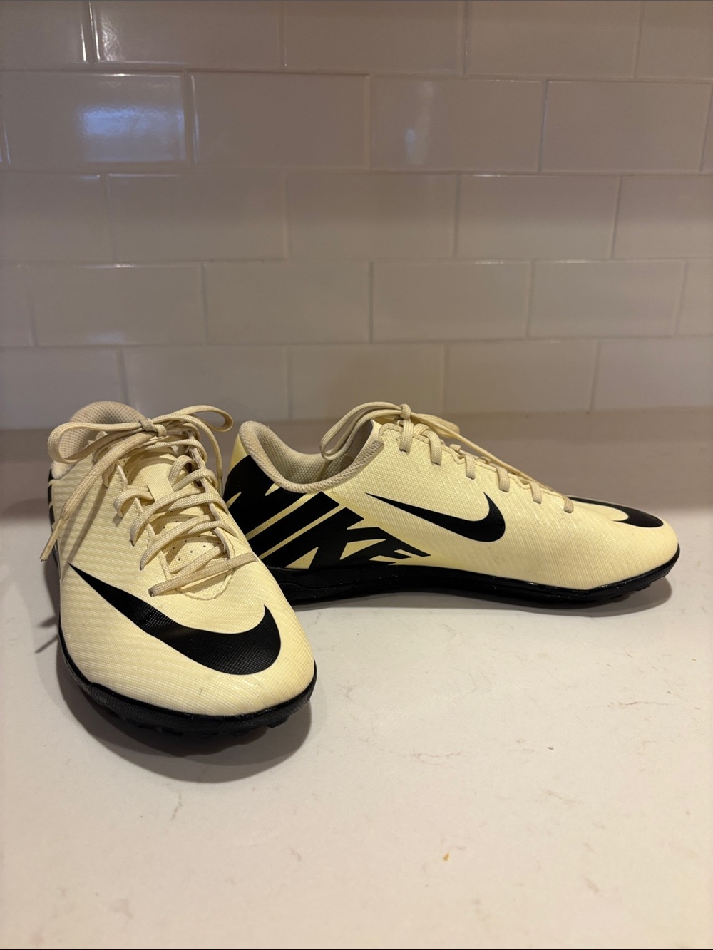 Nike Cream and Black Shoes